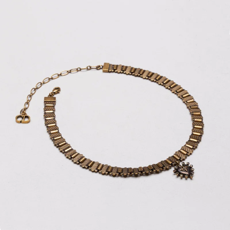 Timeless unisex necklaces -Vintage Dior Heart Choker Necklace in Aged Gold.