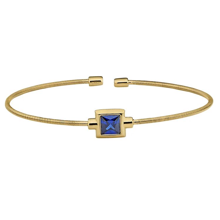 Ladies astral shine bracelets -Gold Finish Sterling Silver Cable Cuff Bracelet with Princess Cut Simulated Blue Topaz Birth Gem